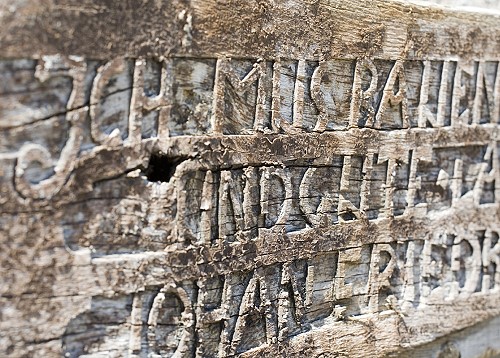 Beams with writing/graffiti and oak archways